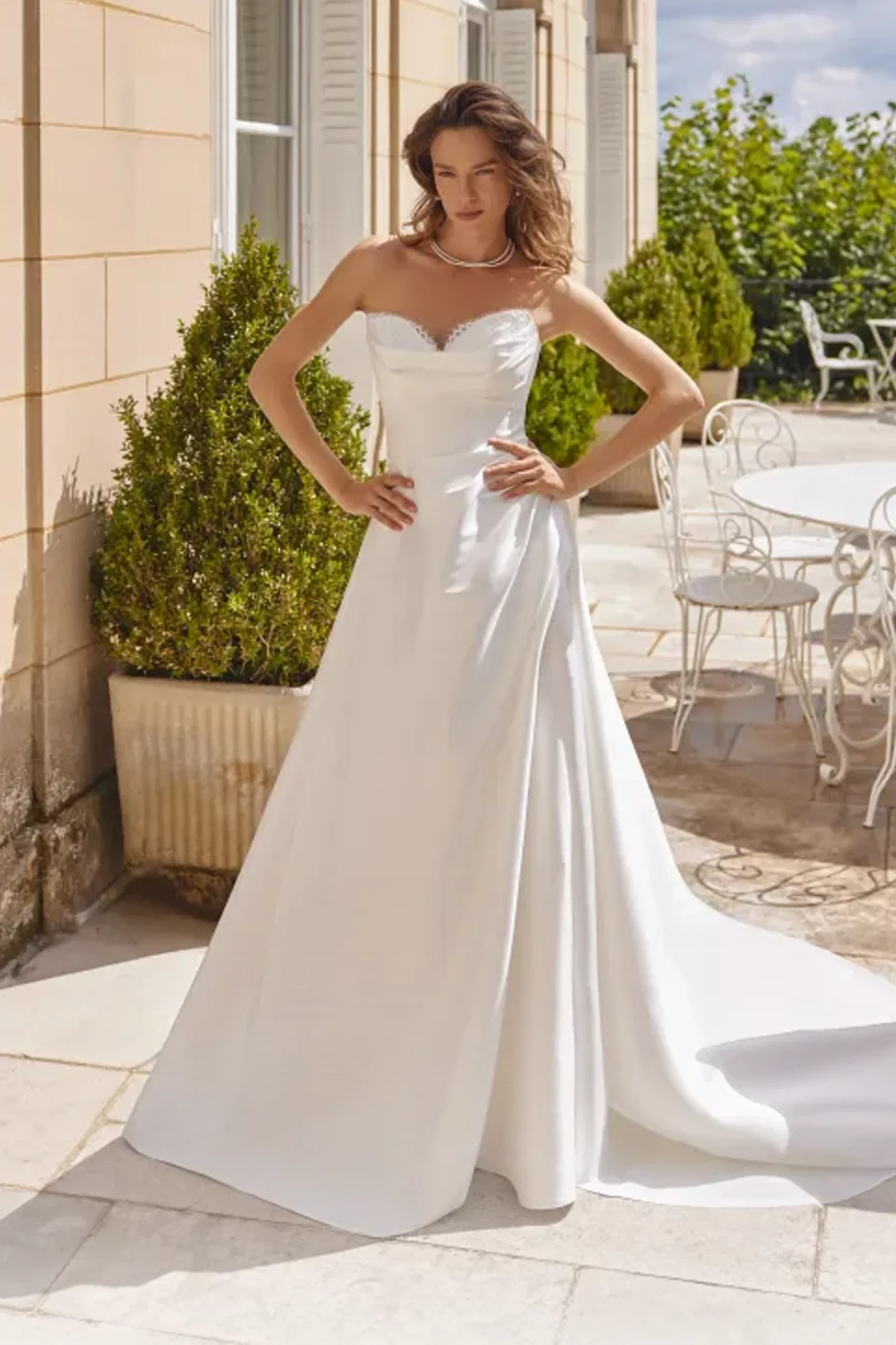 Model wearing a gown by Justin Alexander