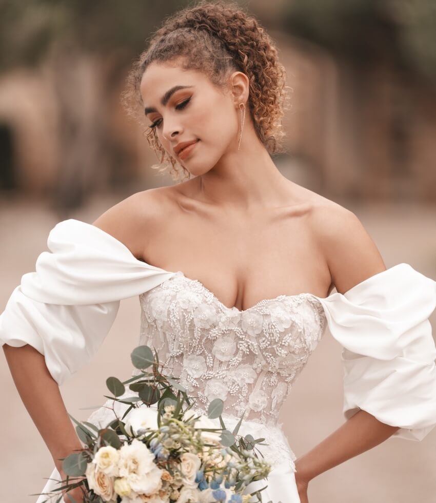 Model wearing a white dress with flowers