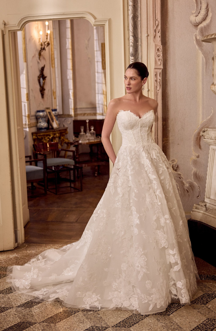 model is wearing a strapless a-line bridal gown